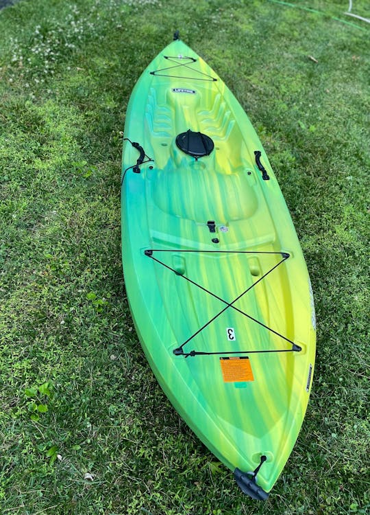 Bold yellow/green 9.5ft sit on top kayak located near Brandywine River