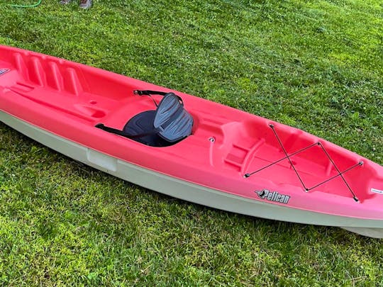 Bright Red 10ft sit on top kayak conveniently located near Brandywine River