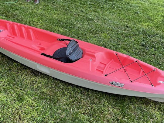 Bright Red 10ft sit on top kayak conveniently located near Brandywine River