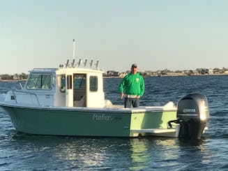 Viaje de pesca y pesca a bordo del barco Parker Sport Cabit de 23 pies