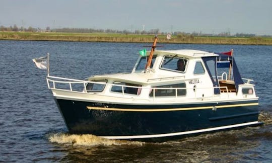 Charter a Unique and Classic Curtevenne 850 Motor Yacht for 4 Person in Terherne
