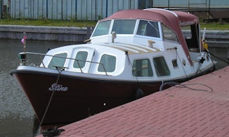 Feel the Relaxing Breeze of Friesland, Netherlands on this Cuddy Cabin Boat