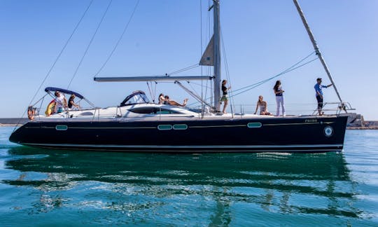 luxury big sailing yacht with blue hull and blue deck