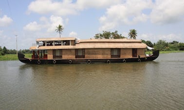 Cruise the Kerala Backwater aboard a Three Room Houseboat for 6 Person