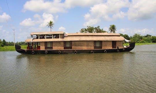 Cruise the Kerala Backwater aboard a Three Room Houseboat for 6 Person