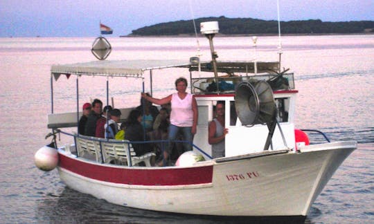Fisherman boat for 10 persons, starts from fažana harbour early in a summer morning.