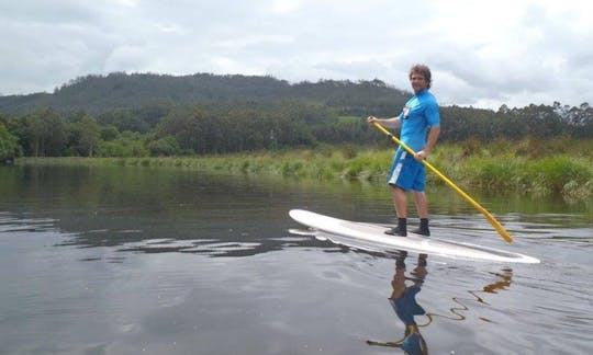 Location et cours de planche à pagaie à la plage de Foz en Galice