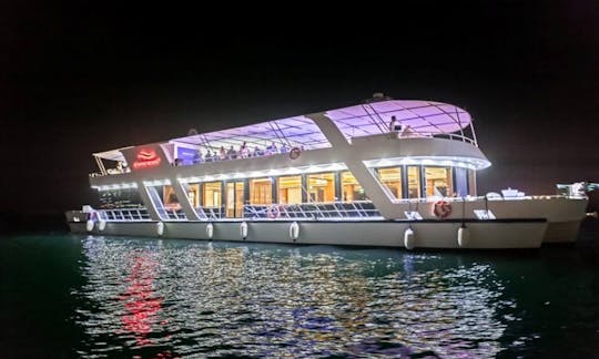 Enjoy Dinner Cruise aboard modern glass houseboat in Dubai