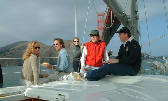 Guest enjoying the deck sailing under the Golden Gate Bridge