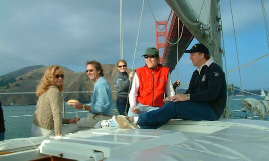 Guest enjoying the deck sailing under the Golden Gate Bridge