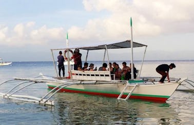 Explore Moalboal, Philippines on a Traditional Boat for up to 15 people