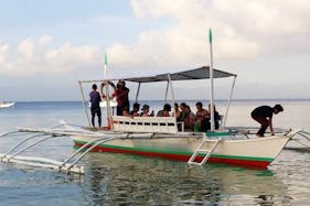 Explore Moalboal, Philippines on a Traditional Boat for up to 15 people