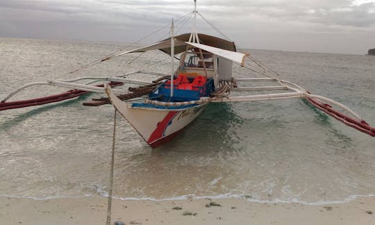 Explore by a Traditional Boat Charter in Carles, Philippines