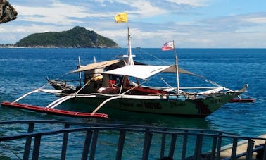 Charter a Traditional Boat in Carles, Philippines