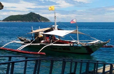 Charter a Traditional Boat in Carles, Philippines