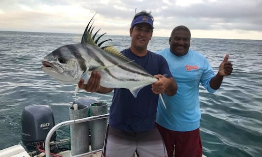 Rooster fish catch with customer and Captain Gerald