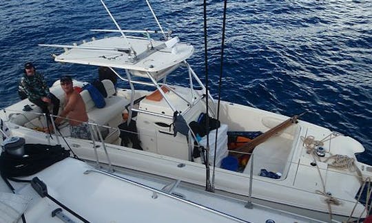 World Cat Sport Fishing Boat alongside live aboard yacht off the Zanzibar Archipelago, Tanzania