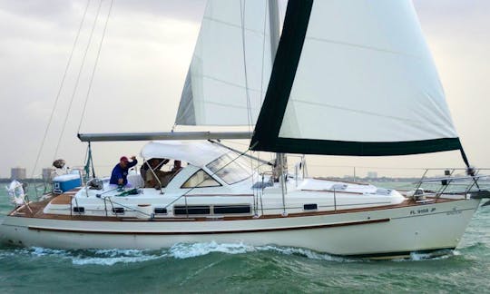 On high winds feel the power of the wind on the safest sailboat around Biscayne Bay