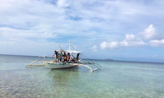 Tour by Traditional Boat with Local Guide in Oslob, Philippines