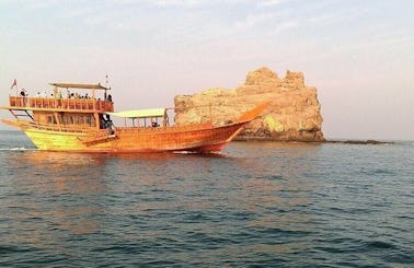 Go on a boat trip on a traditional Dhow boat in Muscat, Oman
