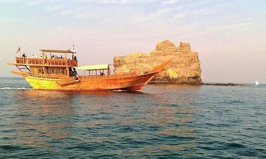 Go on a boat trip on a traditional Dhow boat in Muscat, Oman
