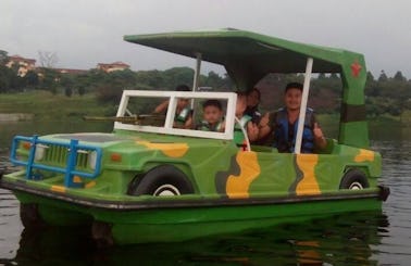 Enjoy Melaka, Malaysia by an Electric Boat Rental (Green Army Jeep)