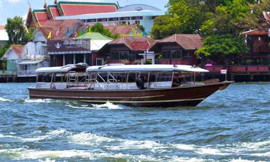 Smaller Sightseeing boat perfect for 16 people cruises on Chao Phraya River in Bangkok, Thailand