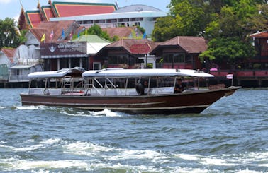 Smaller Sightseeing boat for 16 people cruises on Chao Phraya River