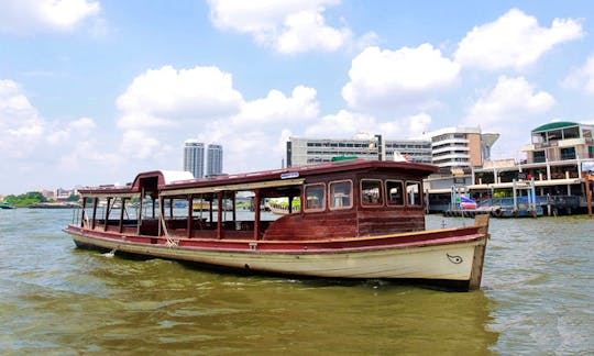 Sightseeing cruise with plenty of space and tables for lunch in Bangkok, Thailand