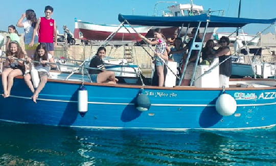 Cruise the water of Leuca, Italy in a shaded boat