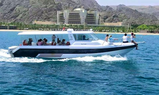 Enjoy Dolphin Watching Tours And Snorkeling Trips in Muscat, Oman on Cuddy Cabin