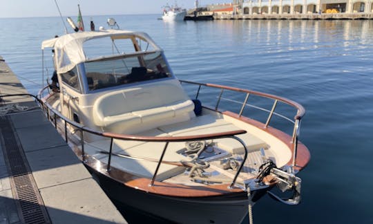 Charter this classic power boat for 7 guests to explore Sorrento and the Almafi Coast