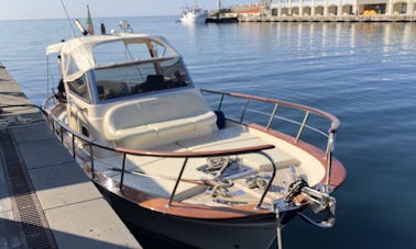 Charter this classic power boat for 7 guests to explore Sorrento and the Almafi Coast