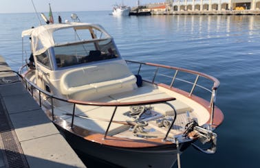 Charter this classic power boat for 7 guests to explore Sorrento and the Almafi Coast