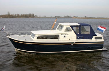 Charter a Unique and Classic Curtevenne 850 Motor Yacht for 4 Person in Terherne