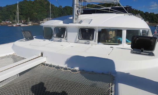 Catamaran Lagoon 380 with crew in le cratère marina, Nosy Be, Madagascar