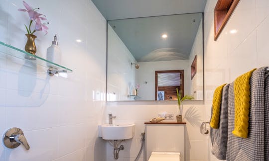 Fully tiled en-suite bathroom with walk in shower