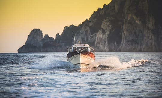 Charter this classic power boat for 7 guests to explore Sorrento and the Almafi Coast