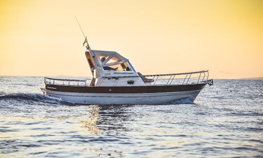 Charter this classic power boat for 7 guests to explore Sorrento and the Almafi Coast