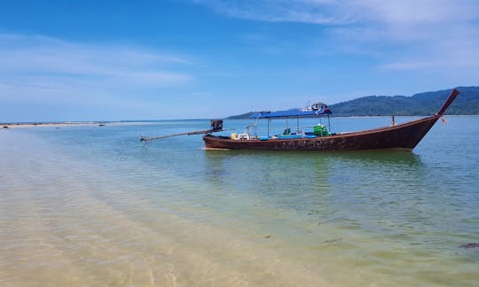 Our comfortable long-tail boat stopped by Khao Na Yak beach.