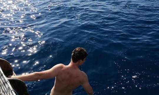 swimming at grotta Azzurra in Taormina