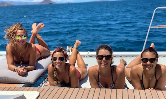 Ladies on the catamaran front deck