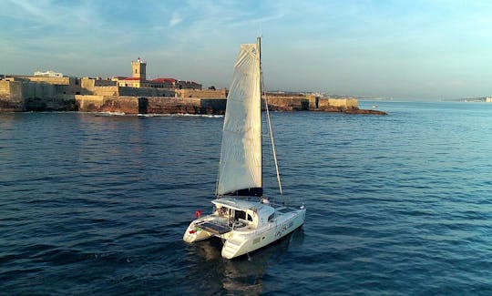Sail in Lisbon and See our Monuments! Book the Lagoon 380 S2 Cruising Catamaran -