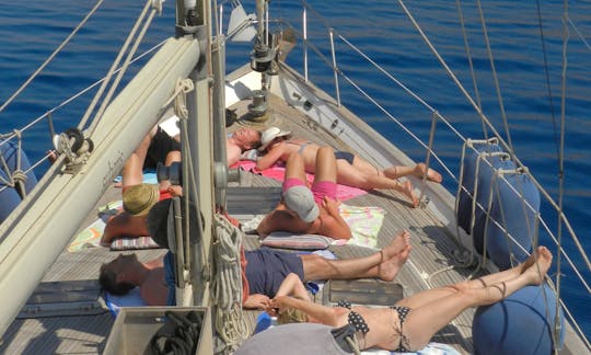 Sail cruising among the Dodecanese islands in Greece