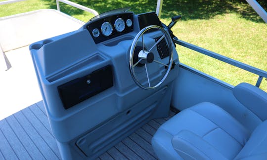 Reclining Captains Seat. Depth finder, speedometer, and switch panel controls.