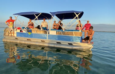 Amazing Fisher 24' Pontoon Boat to rent in Cudjoe Key, FL. Multi day, weekly, or monthly rental. We deliver!