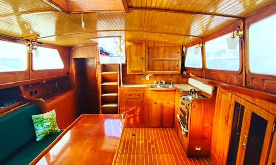 Calypso's classic yacht salon made of varnished mahogany, teak, and holly. She’s roomy and ready to entertain! 6’6’ headroom!