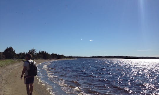 Walking along the sandbar that divides the lake from the ocean after docking kayaks on the sandbar.