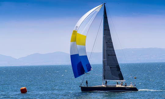 Experience the speed and power of spinnaker sailing.