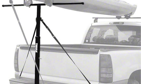 Includes a hitch-connecting canoe rack.